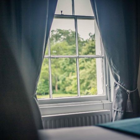 Caistor Hall Arminghall Buitenkant foto